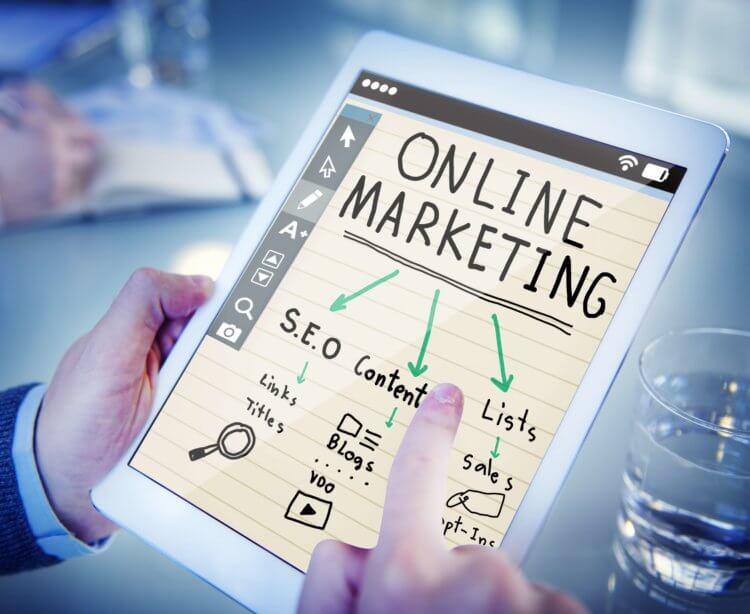 Photo of a tablet with an online marketing diagram