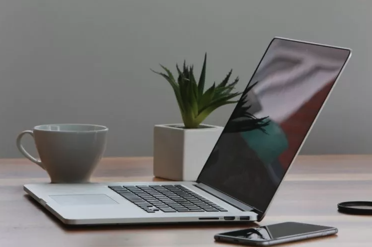 macbook pro laptop on a desk