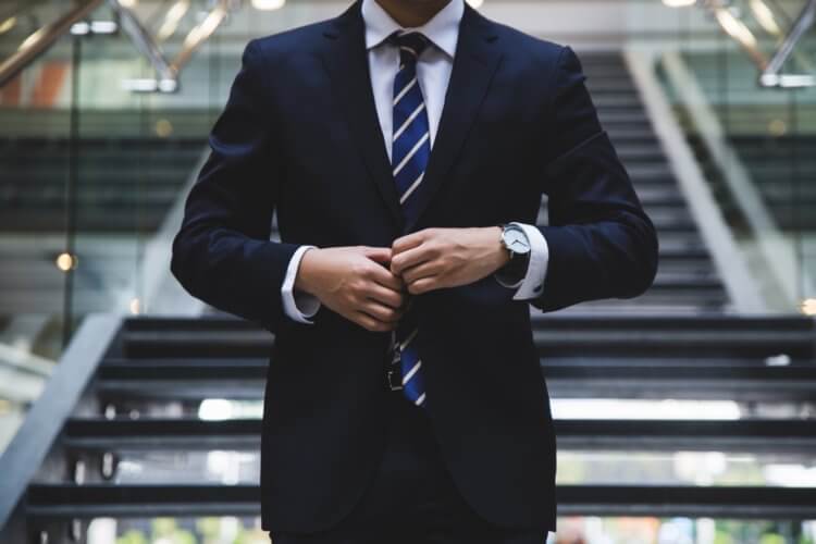 Photo of a lawyer in a suit thinking about the severity of a legal malpractice insurance claim