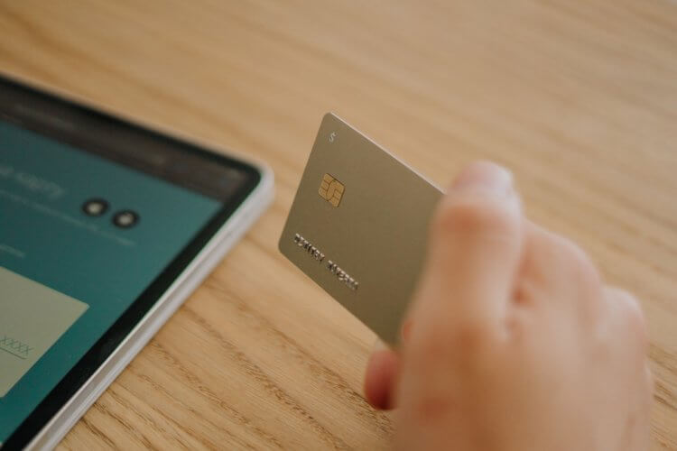closeup of client holding a credit card