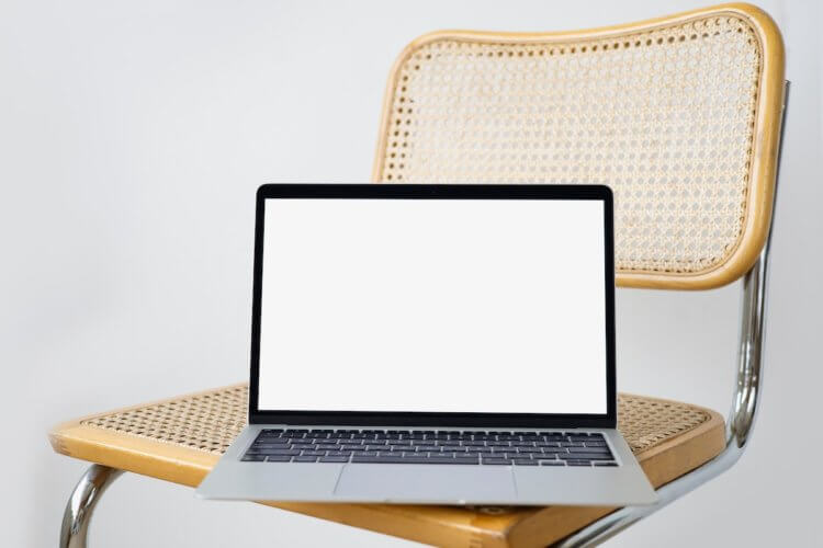 Image of a laptop on a chair