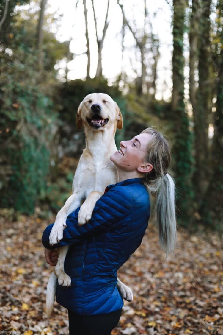 woman hiking with dog
