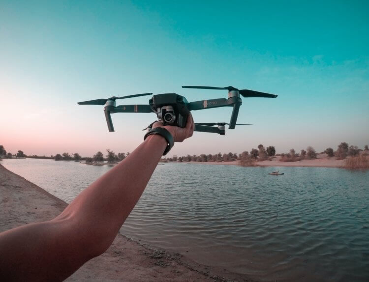 person launching a drone