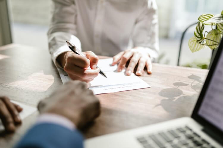 Two legal professionals working on law firm chart of accounts sample regarding client expense accounts