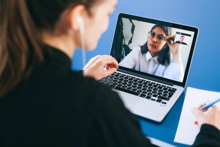 Photo of a woman on a video call on her laptop