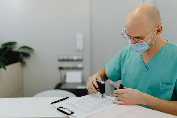 Medical professional reviewing documents