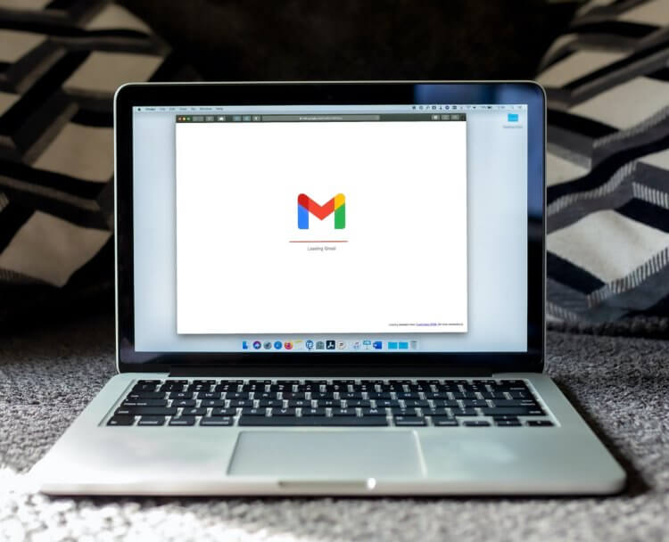A photo of a laptop showing Gmail on the screen