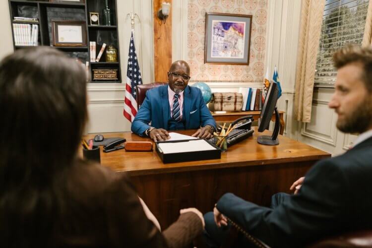 Family lawyer meeting with two clients