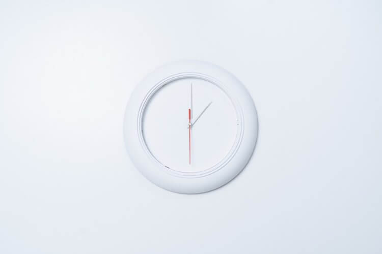 White clock against a white wall