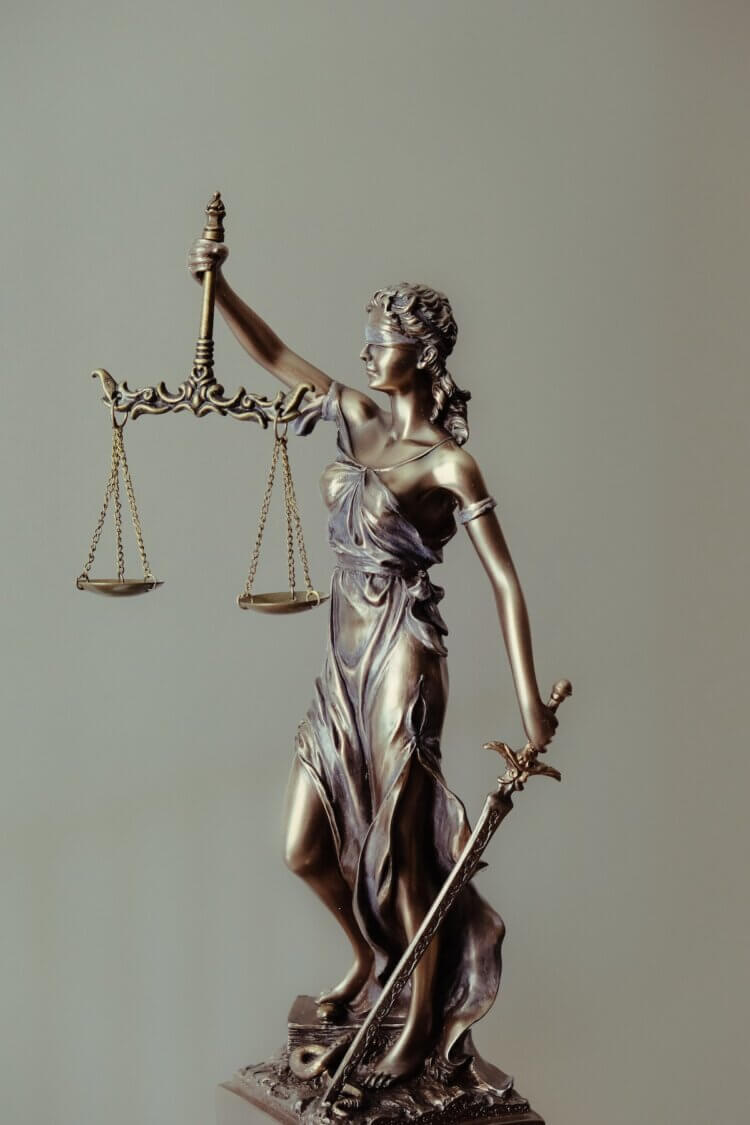 A photo of the lady justice statue symbolizing lawyer ethics