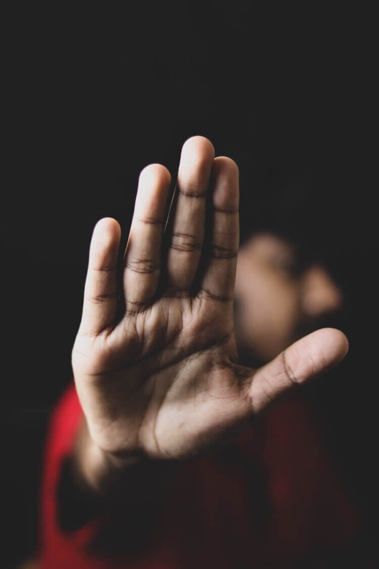 Lawyer raises hand while objecting in court