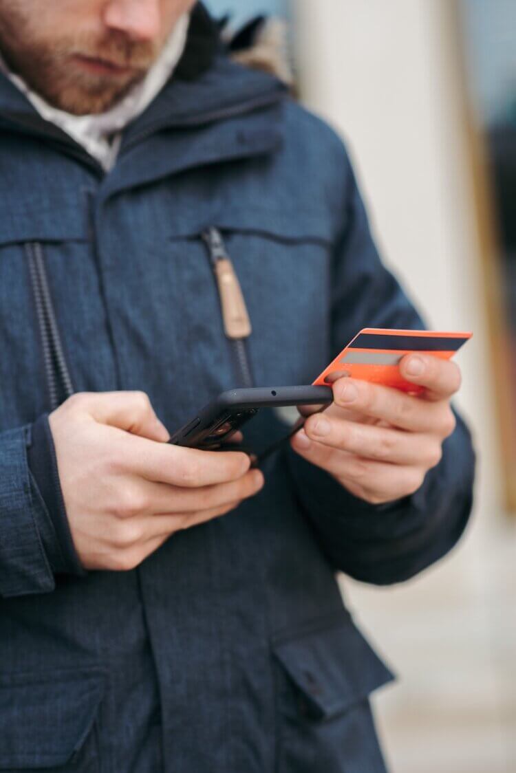 A client pays for his legal services on his phone using a credit card