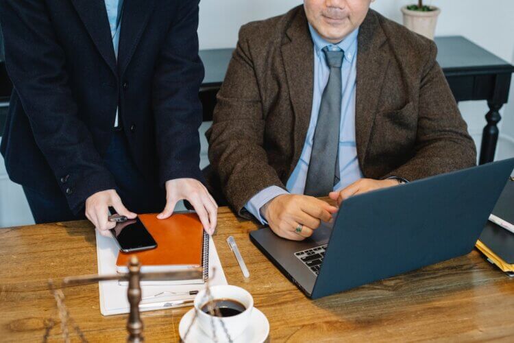 Two lawyers meeting at a desk