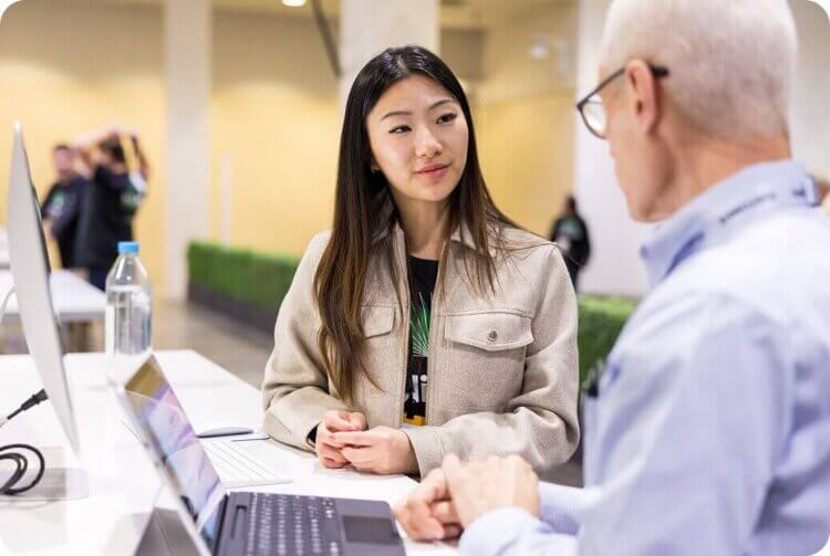 Woman and man looking at a laptop